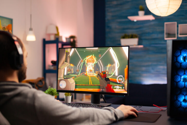 Pro virtual gamer wearing headphones playing video game