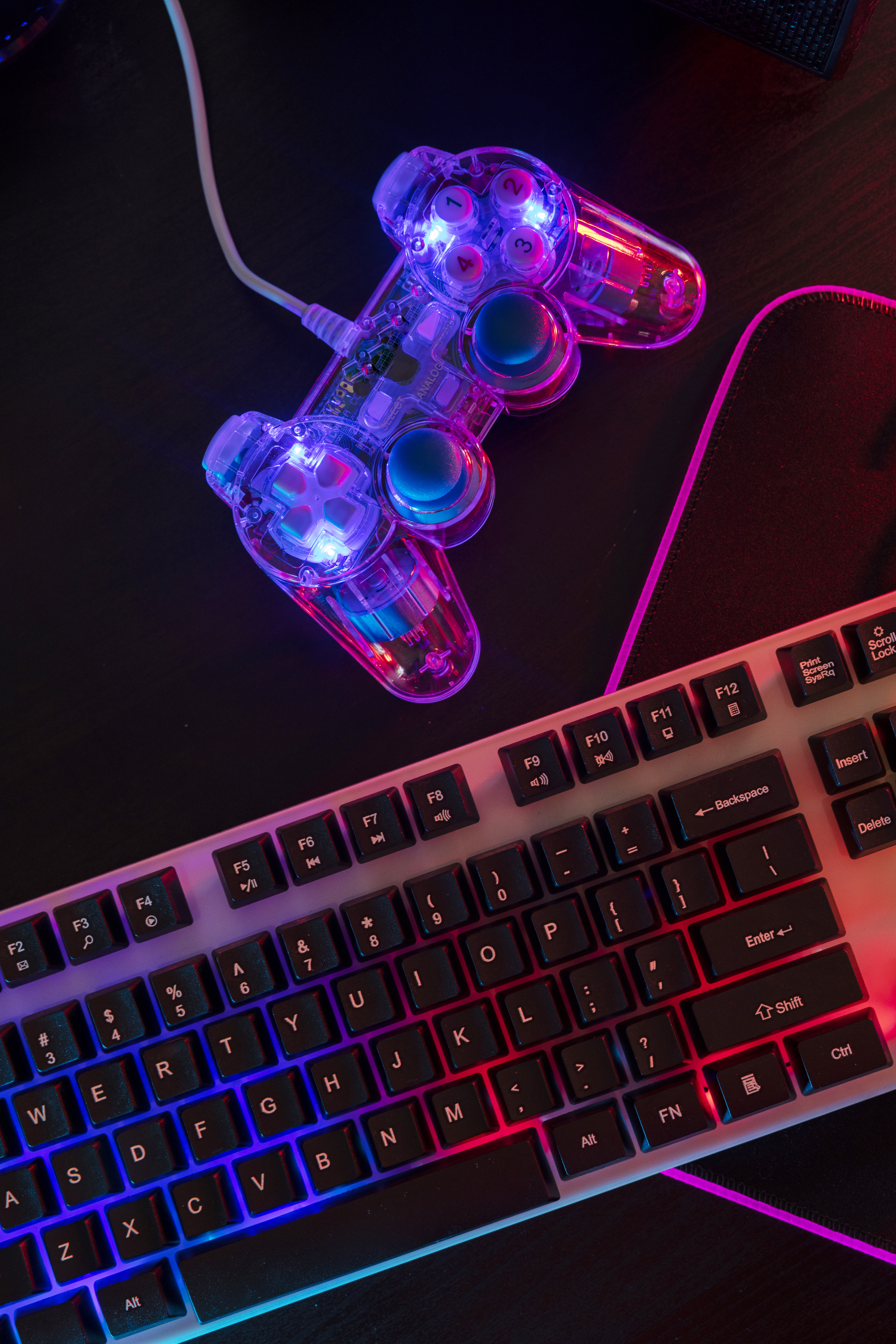 view illuminated neon gaming keyboard setup controller